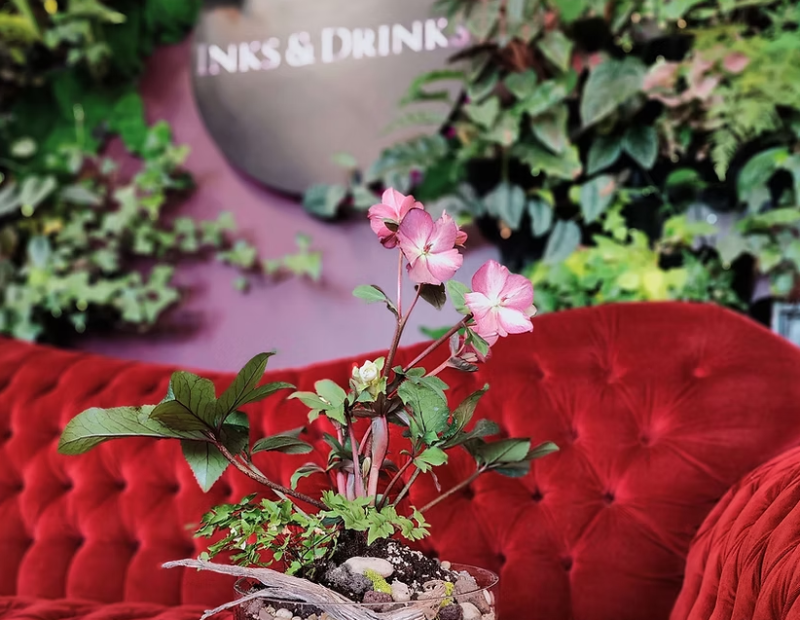 Flowers, red chair and signage for Inks and Drinks
