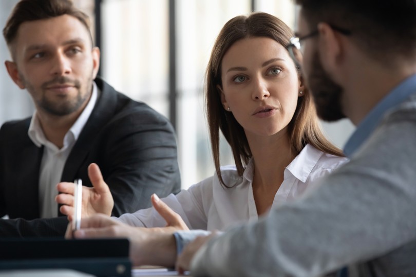 Three people having a business meeting