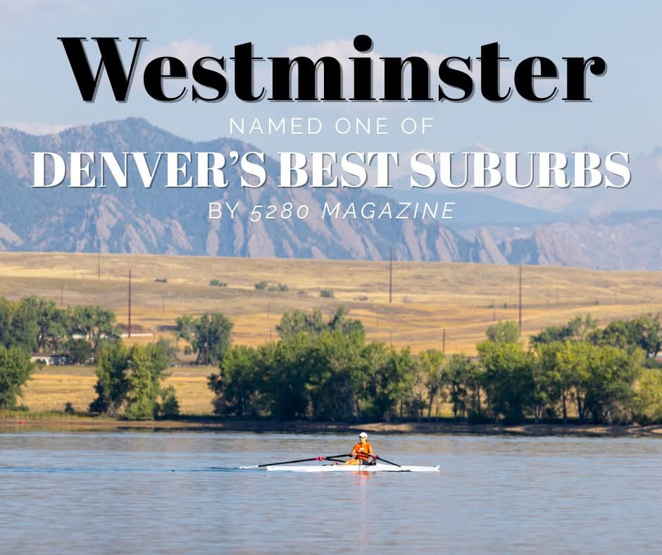 Kayaker on Standley Lake with mountains behind