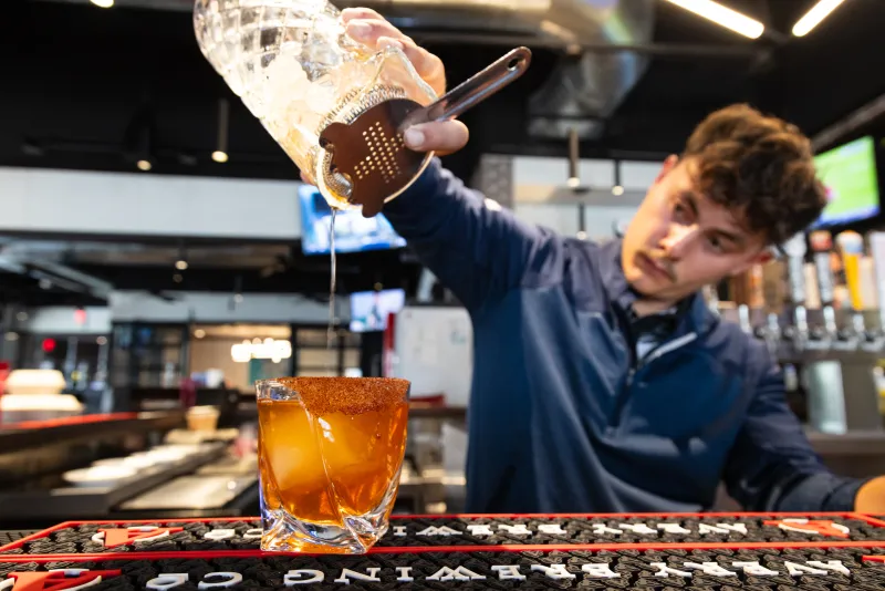 Bartender pouring a drink