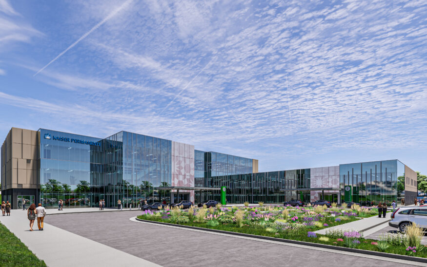 Large glass medical building rendering with people walking outside and a drive with flowers